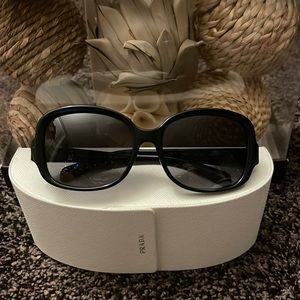 Authentic Prada sunglasses and case in great condition small scratch not notice